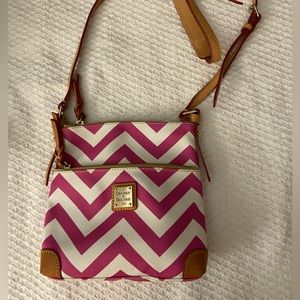 Dooney and Bourke.       Pink and white “letter carrier crossbody bag”